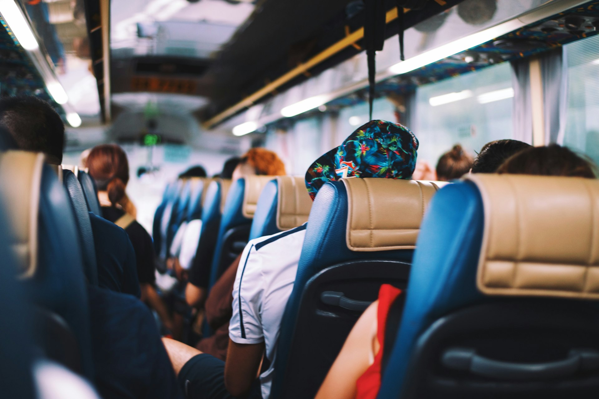 Passengers seated inside a coach during a shuttle transfer