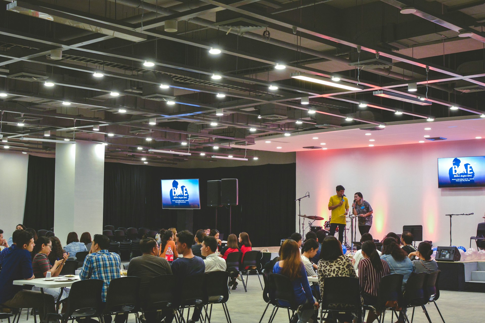 Wide view of a conference floor set for a large session